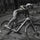 Person riding a mountain bike on a dirt path in a forest